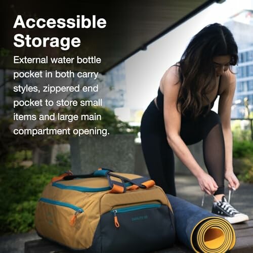Person tying shoes next to a duffel bag with accessible storage features.