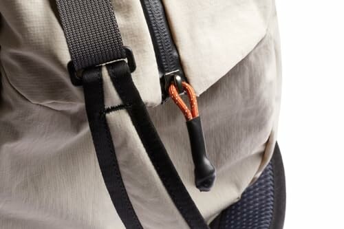 Closeup of a backpack strap and zipper