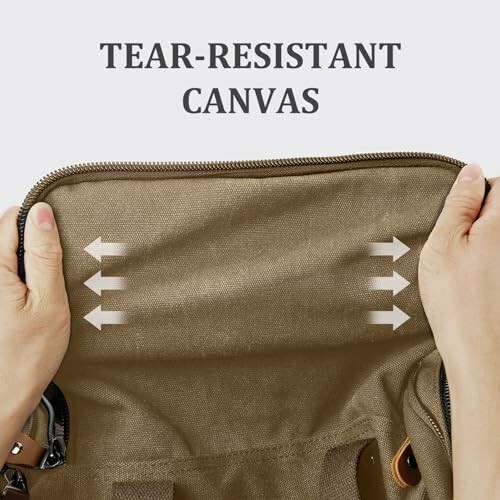 Hands stretching tear-resistant canvas fabric